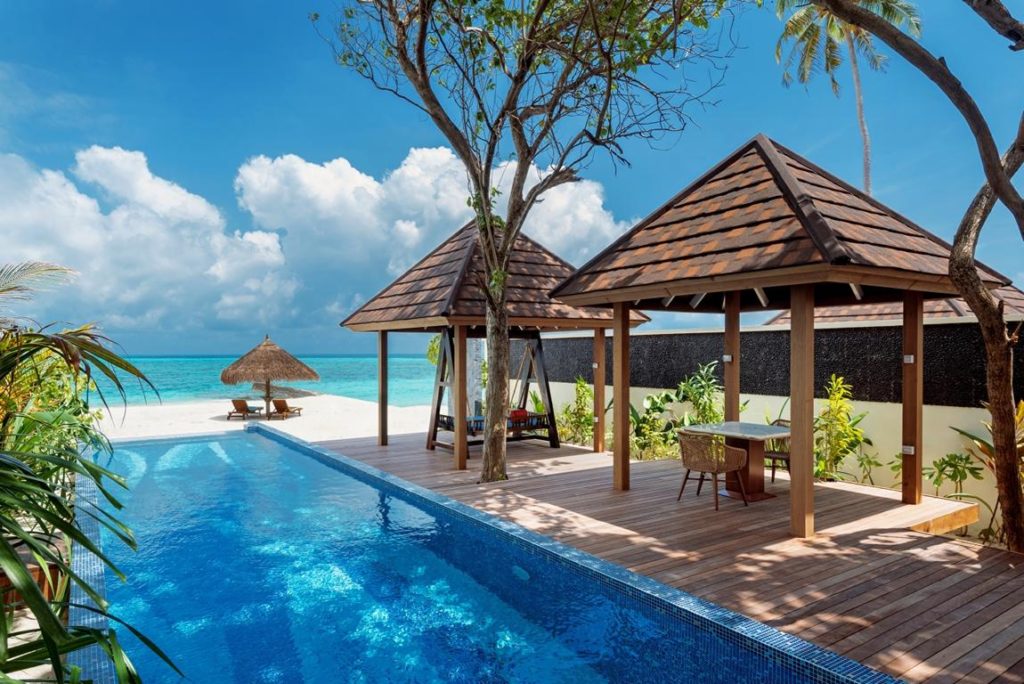 atmosphere kanifushi maldives grand pool villa pool view catmosphere hotels resorts