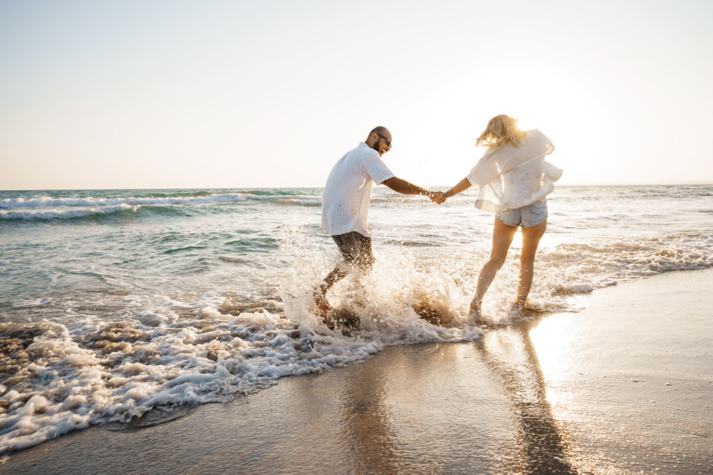 young beautiful couple walking on beach near sea 2022 01 18 23 34 05 utc
