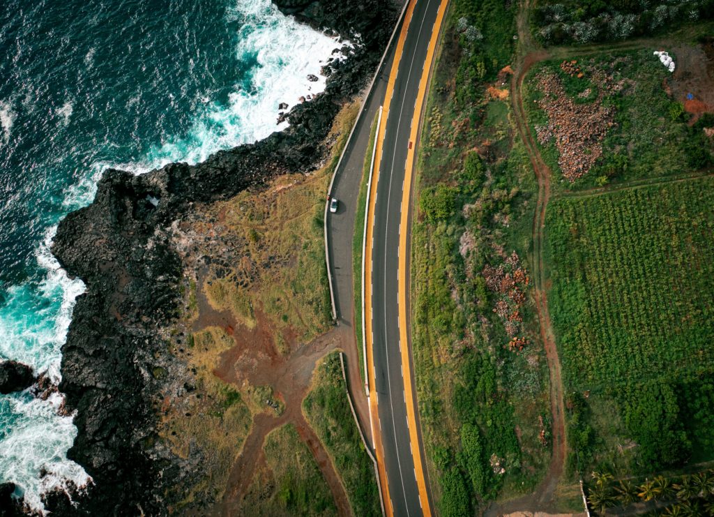 aerial shot of a road on the coast of reunion isla 2022 12 22 20 24 54 utc